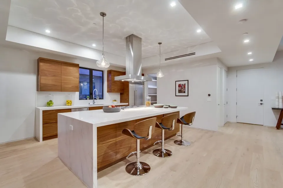Kitchen island with stone countertop and seating
