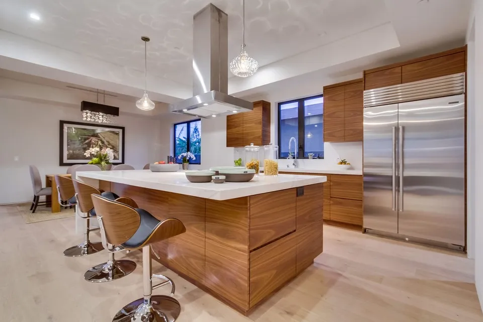 Wood kitchen island and pendant lighting